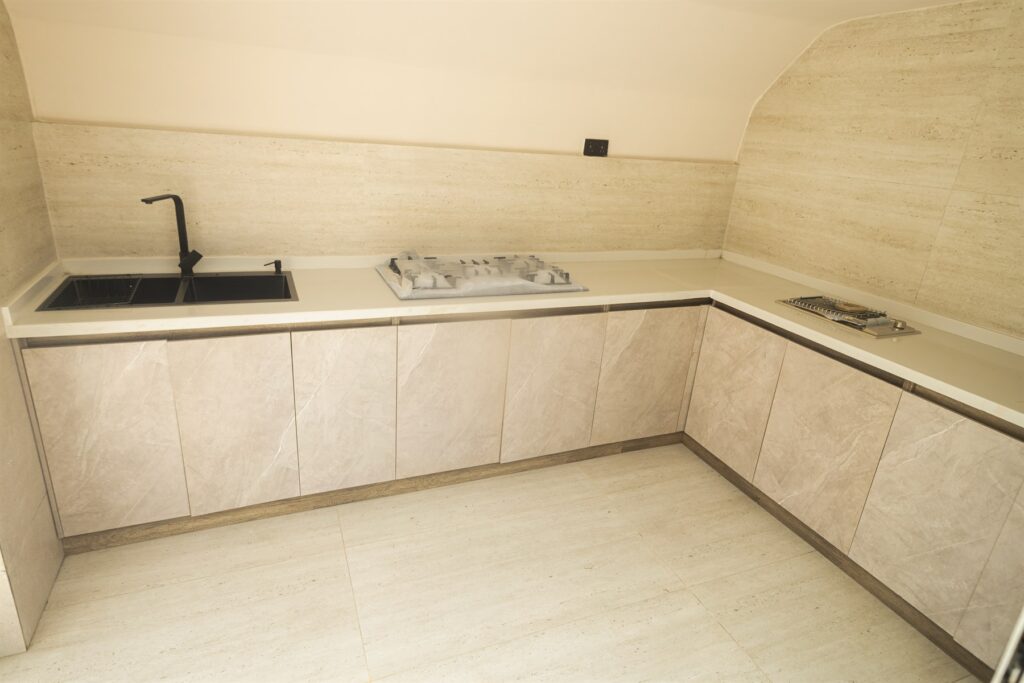 Brum Height 6: Compact fitted kitchen with a sink and hob